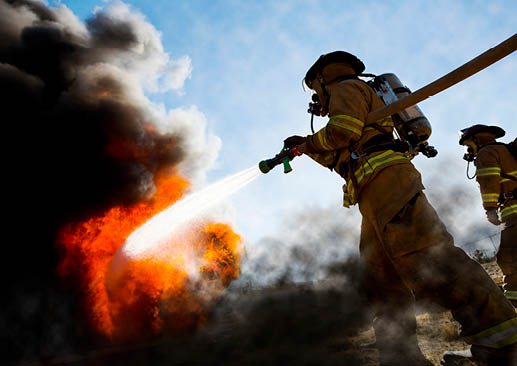 Firefighter battles the flames